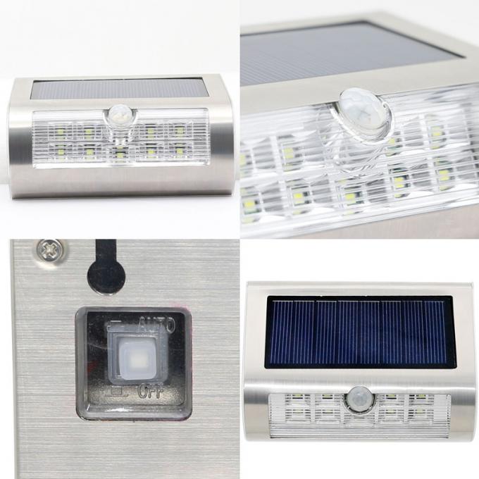 Luzes solares fixadas na parede exteriores solares do sensor de movimento no jardim